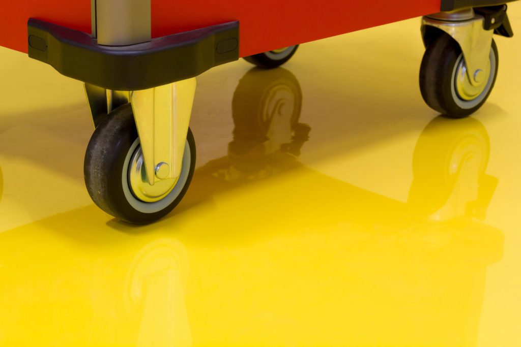 Wheels of Drawer roller tool cabinet on the yellow epoxy floor